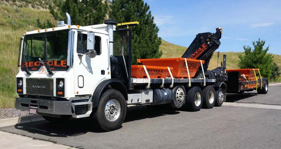 Recycle Solutions truck hauling washout containers across the Front Range