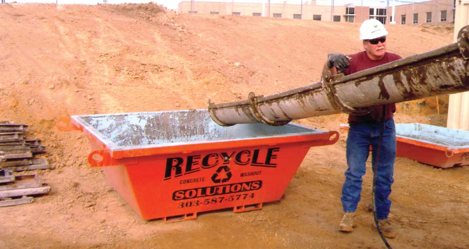 Pumping concrete washout into a Recycle Solutions container on a jobsite